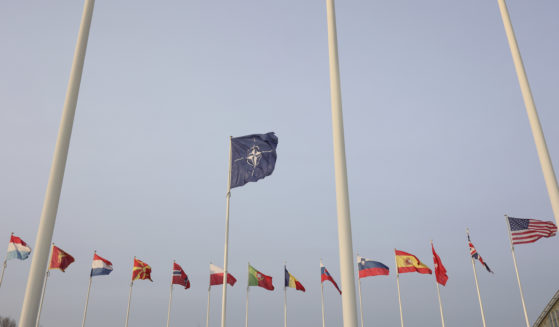 Flags of NATO members fly outside the NATO headquarters ahead of NATO Secretary General Jens Stoltenberg, European Commission President Ursula von der Leyen and European Council President Charles Michel signing a joint declaration on NATO-EU Cooperation at NATO headquarters in Brussels, Belgium, on Tuesday.