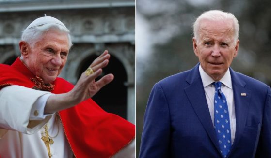 President Joe Biden, right, was evasive when questioned by a reporter about why he would not attend Pope Benedict XVI's funeral.