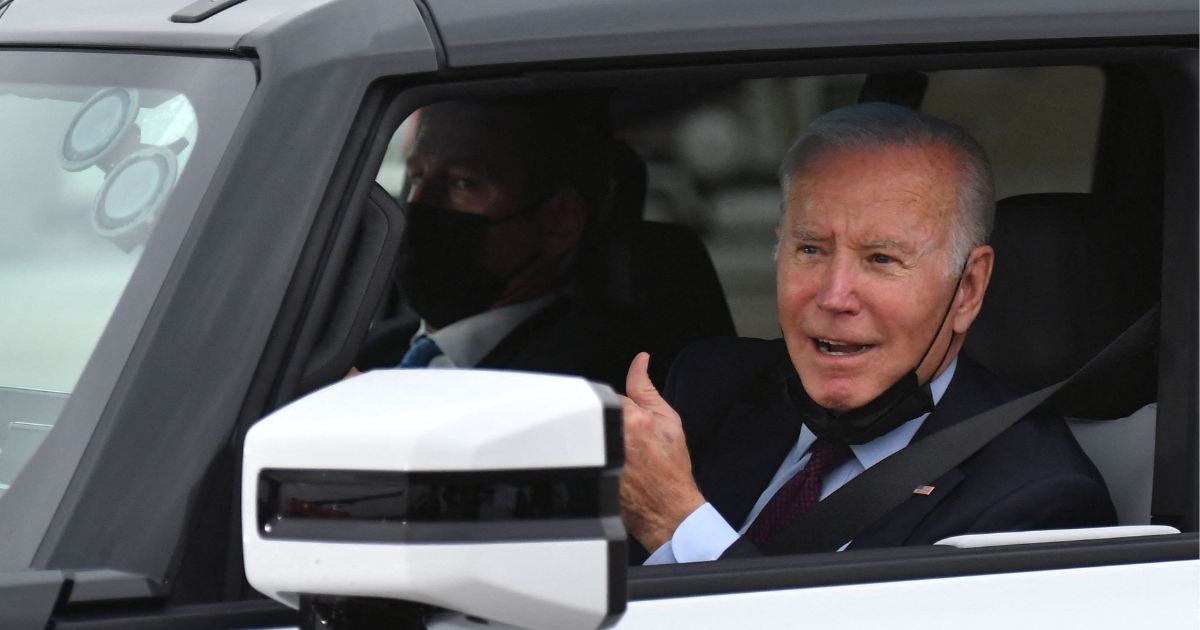 Joe Biden test drives an electric hummer as he tours the General Motors Factory ZERO electric vehicle assembly plant in Detroit, Michigan on November 17, 2021.