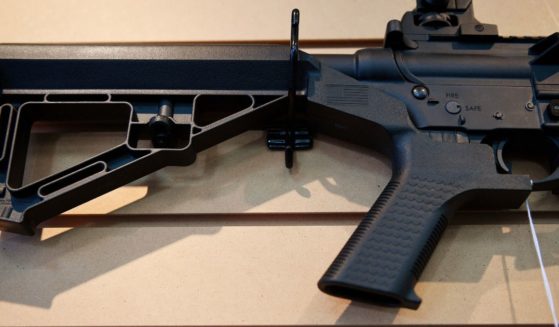 A bump stock installed on an AR-15 rifle is seen in a file photo from 2017.