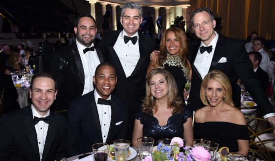 Suzanne Malveaux, second from right in the back row, poses with CNN colleagues Teddy Davis, Noah Gray, Don Lemon, Jim Acosta, Brianna Keilar, Jake Tapper and Dana Bash during a media event at DAR Constitution Hall in Washington on April 29, 2017.