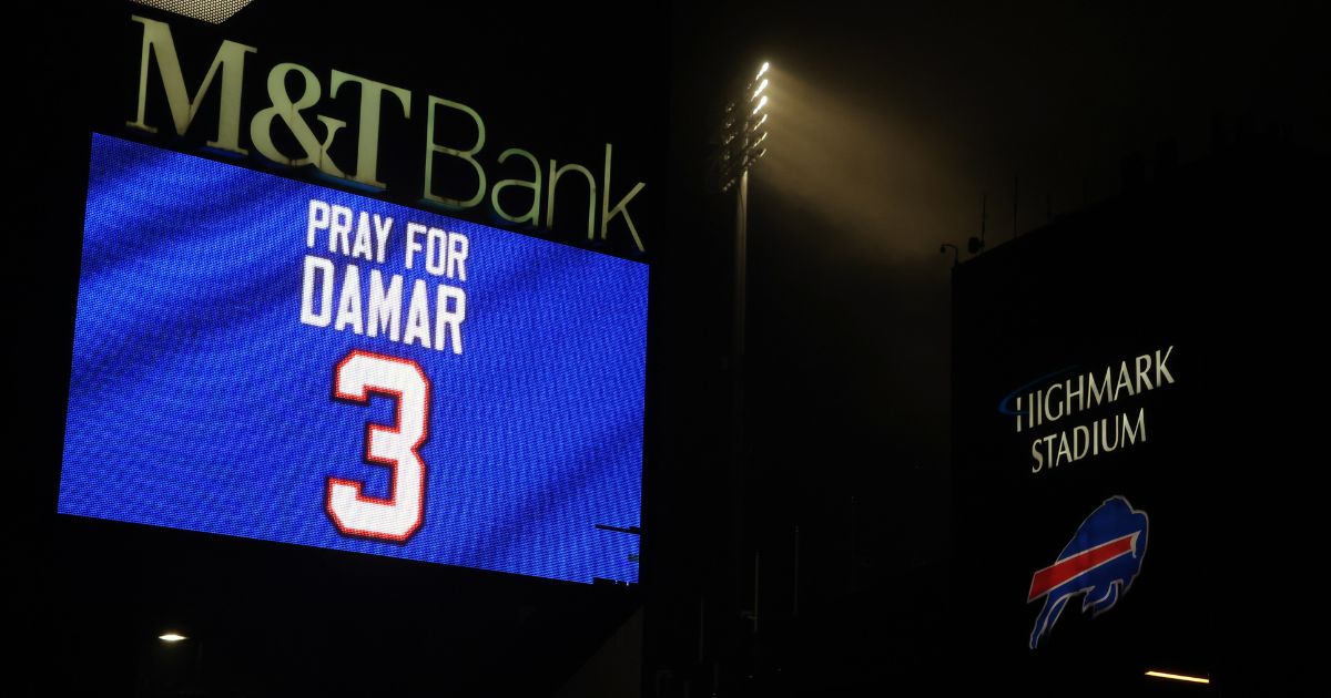 Buffalo Bills fans attend a candlelight prayer vigil for safety Damar Hamlin at Highmark Stadium in Orchard Park, New York, on Tuesday.