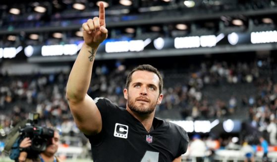 Quarterback Derek Carr points to the home crowd after the Las Vegas Raiders beat the Los Angeles Chargers 27-20 at Allegiant Stadium on Dec. 4.