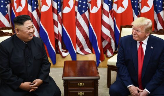 North Korea's leader Kim Jong Un, left, and U.S. President Donald Trump attend a meeting in the demilitarized zone between North and South Korea on June 30, 2019.