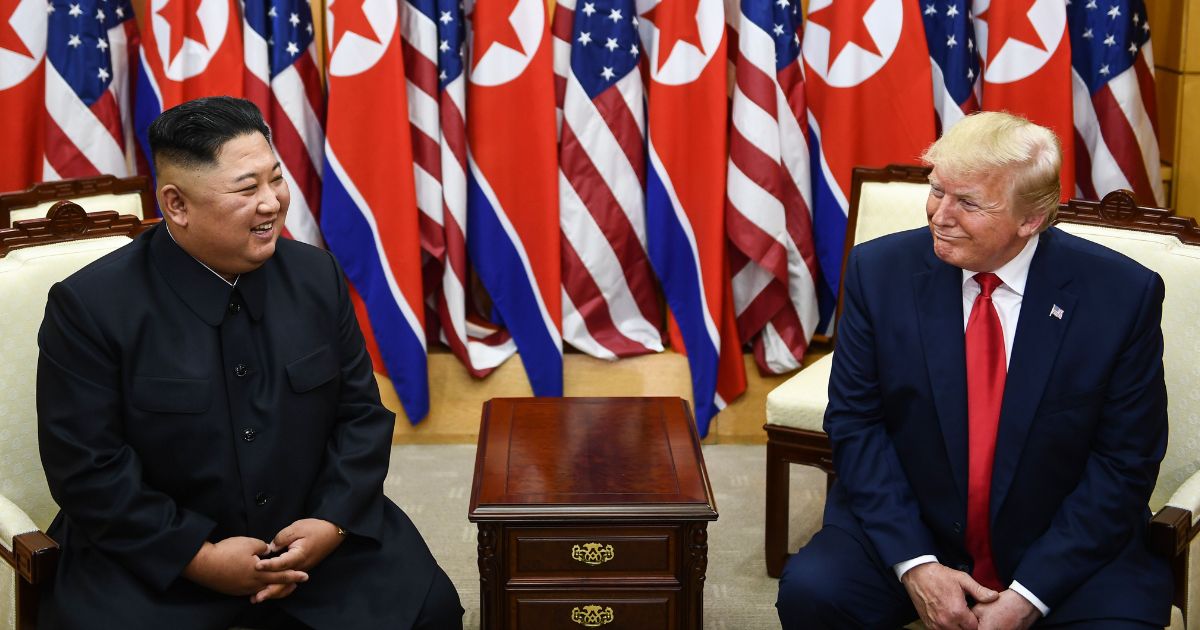 North Korea's leader Kim Jong Un, left, and U.S. President Donald Trump attend a meeting in the demilitarized zone between North and South Korea on June 30, 2019.