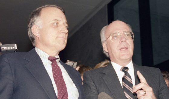 Then-Sens. David Durenberger, left, and Patrick Leahy, right, speak with reporters during a news conference on Capitol Hill in Washington on Dec. 18, 1986.