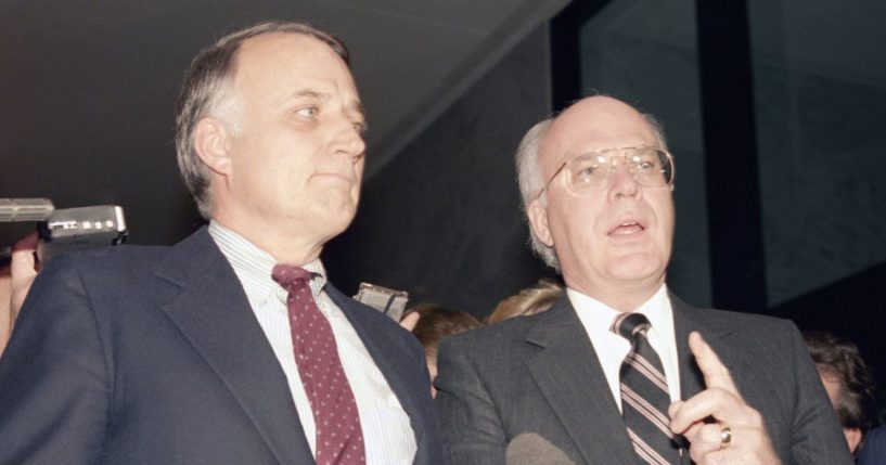 Then-Sens. David Durenberger, left, and Patrick Leahy, right, speak with reporters during a news conference on Capitol Hill in Washington on Dec. 18, 1986.