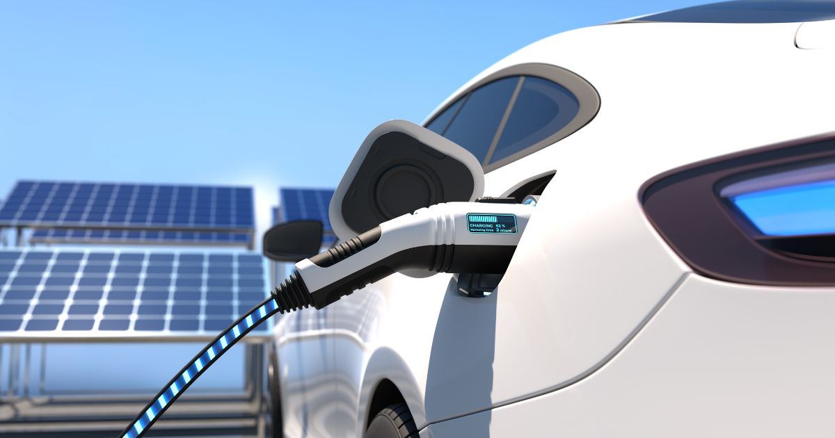 This stock photo shows an electric vehicle charging at a charging station.