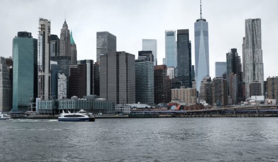 The Manhattan skyline is visible across the East River in New York City on March 28, 2022.