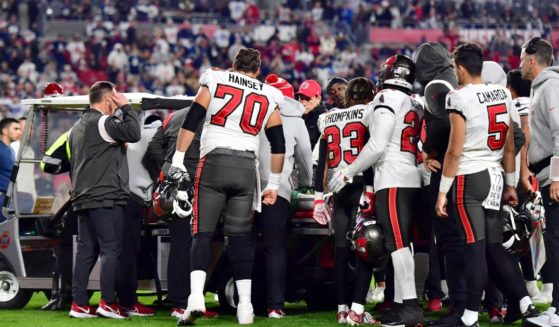 Tampa Bay Buccaneers wide receiver Russell Gage is surrounded by his teammates as he is carted off the field after suffering an injury during the fourth quarter of a wild-card playoff game against the Dallas Cowboys at Raymond James Stadium on Monday night.