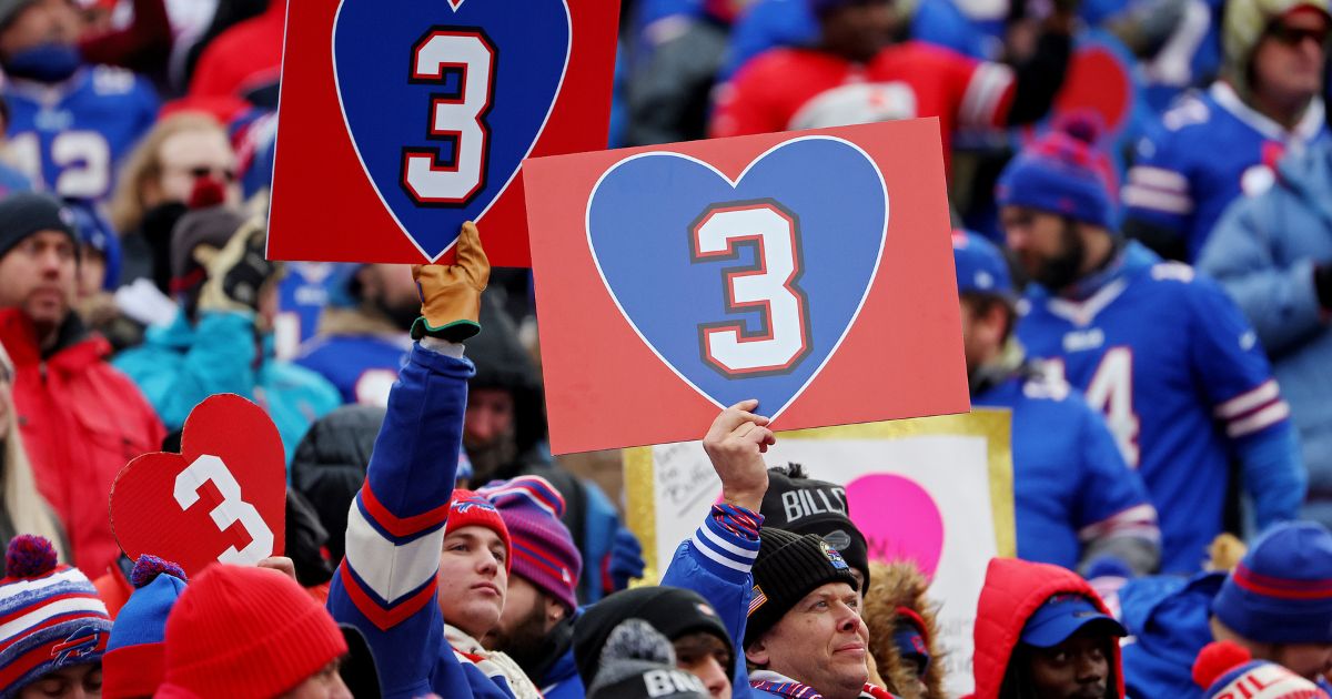 Buffalo Bills fans hold signs in support of Bills safety Damar Hamlin during a game against the New England Patriots at Highmark Stadium on Jan. 8 in Orchard Park, New York.