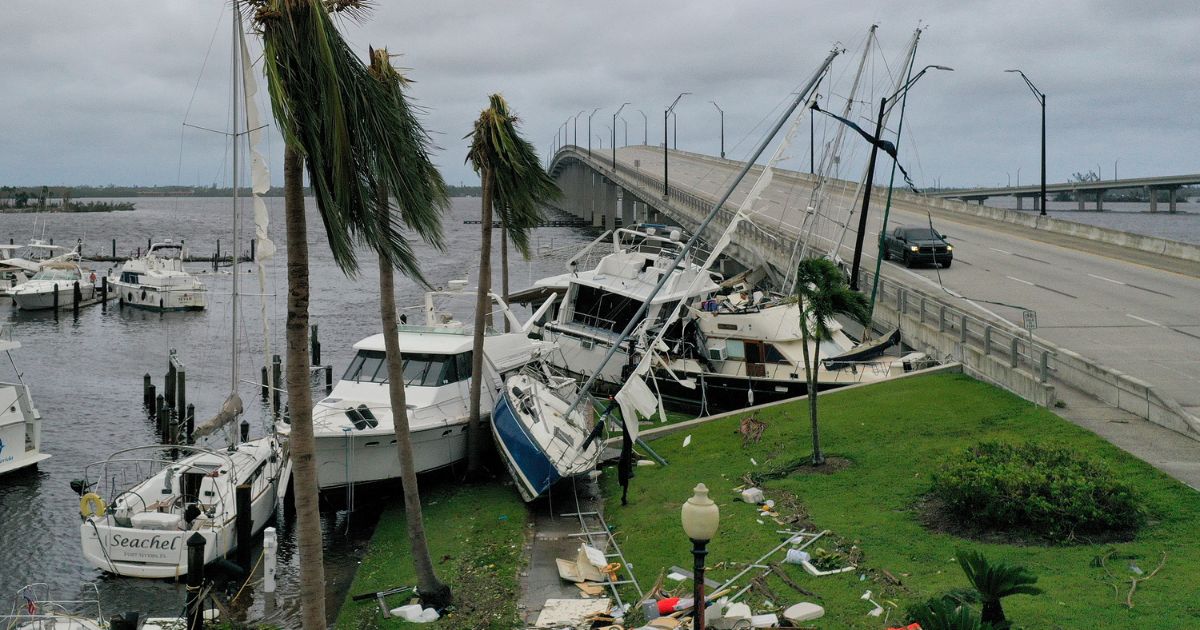 Boats are pushed up on a causeway in Fort Meyers, Florida, following Hurricane Ian.