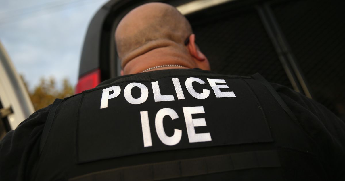 U.S. Immigration and Customs Enforcement (ICE), agents detain an immigrant on Oct. 14, 2015, in Los Angeles.