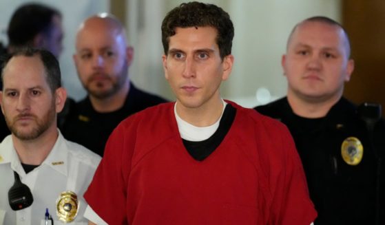 The suspect in the quadruple homicide of four University of Idaho students, Bryan Kohberger, is escorted to an extradition hearing at the Monroe County Courthouse in Stroudsburg, Pennsylvania, on Tuesday.