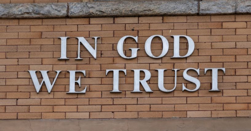 "In God We Trust" appears on the wall of a courthouse in Statesville, North Carolina, on April 24, 2020.