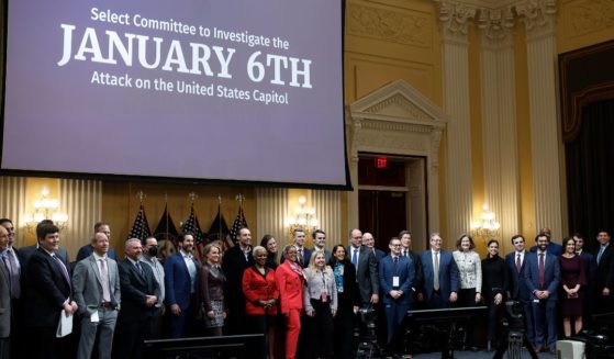 Staff members of the Jan. 6 committee pose for a group photo following the committee's last public hearing on Capitol Hill on Dec. 19, 2022, in Washington, D.C.