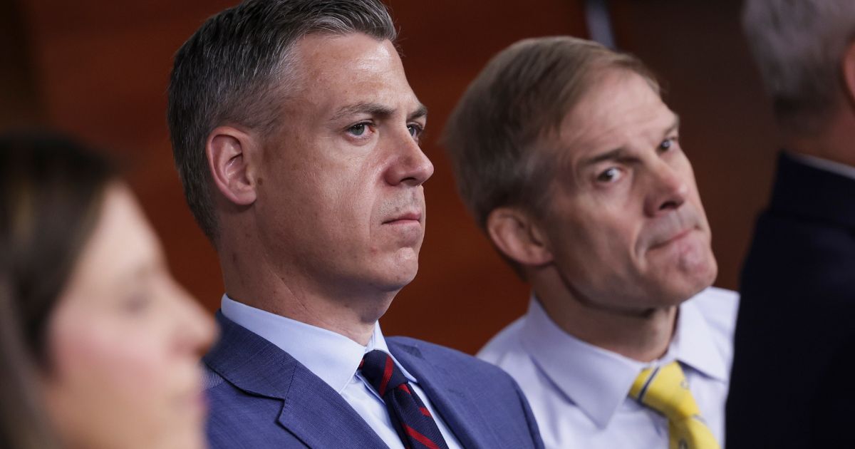 Rep. Jim Banks, left, and Rep. Jim Jordan listen during a news conference at the U.S. Capitol on June 8, 2022, in Washington, D.C.