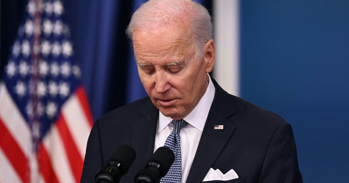 President Joe Biden reads a statement to reporters at the Eisenhower Executive Office Building in Washington on Thursday.