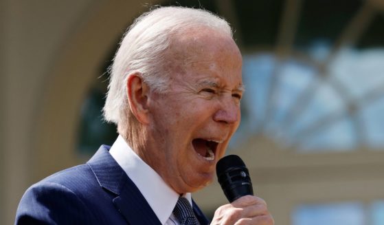 President Joe Biden shouts during an event in the Rose Garden at the White House in Washington on Sept. 27.