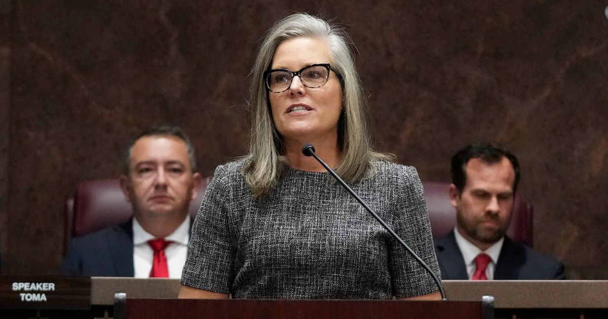 Arizona Democratic Gov. Katie Hobbs, flanked by state House Speaker Ben Toma, left, and Senate President Warren Petersen, both Republicans, delivers her State of the State address at the Arizona Capitol in Phoenix on Monday.