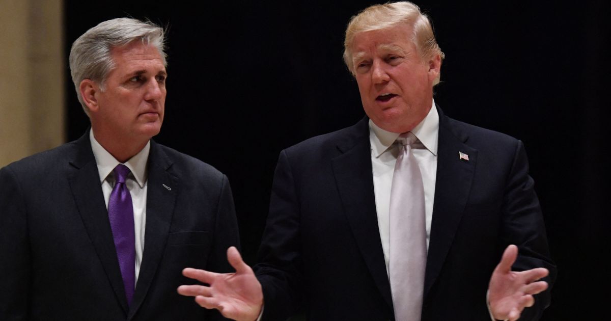 Then-President Donald Trump, right, is seen in a 2018 file photo speaking with then-House Majority Leader Kevin McCarthy. During a recent interview, McCarthy shared stories about Trump's anonymous generosity.