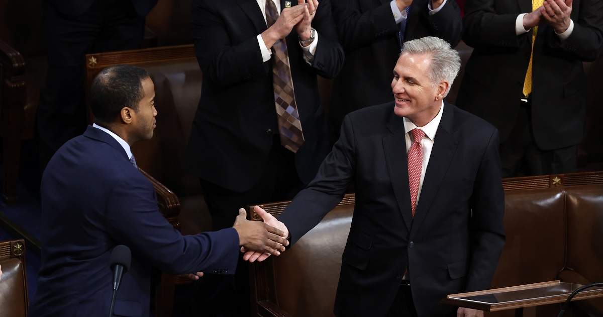 U.S. House Republican Leader Kevin McCarthy shakes hands with Rep.-elect John James in the House Chamber during the third day of elections for Speaker of the House at the U.S. Capitol Building on January 05, 2023 in Washington, DC.
