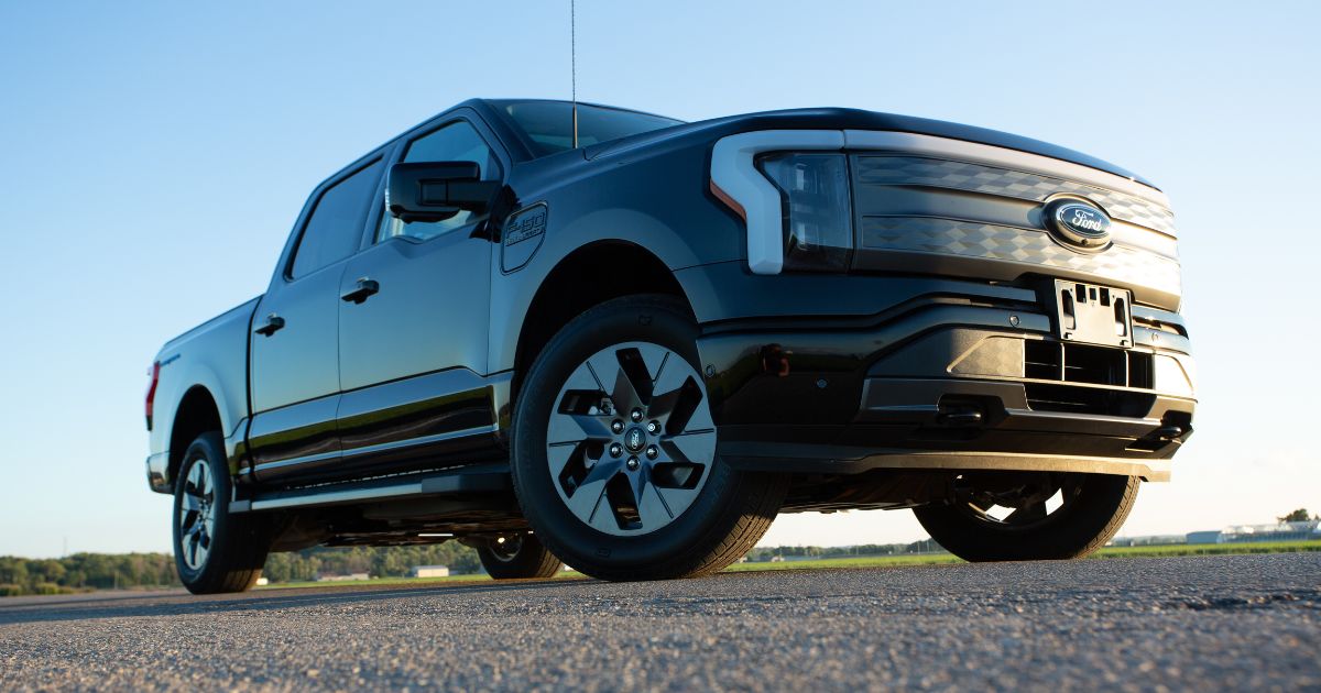 A Ford F-150 Lightning electric pickup truck is seen on the road in Ontario, Canada, on Aug. 23.