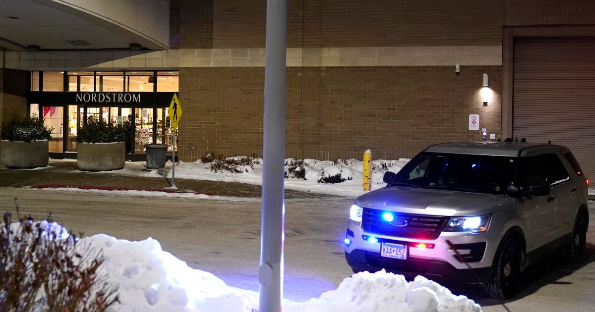 A police car sits parked outside Nordstrom at Mall of America after a fatal shooting Dec. 23 in Bloomington, Minnesota.