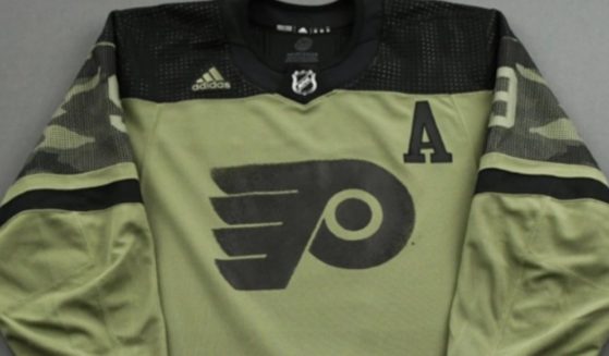 ESPN reporter Greg Wyshynski shared a photo of Philadelphia Flyers defenseman Ivan Provorov's previously work military appreciation jersey in an attempt to discredit his refusal to not wear a "pride" jersey due to his religious beliefs.