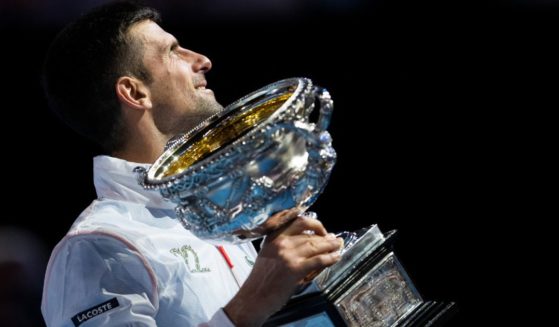 Serbian tennis player Novak Djokovic poses with the Norman Brookes Challenge Cup after winning the men's single final match at the 2023 Australian Open in Melbourne, Australia on Sunday.