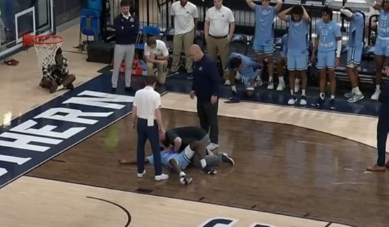 Old Dominion sophomore guard Imo Essien lies on the court after collapsing during a game against Georgia Southern.