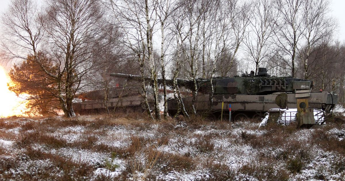 Leopard 2 tanks participate in a firing exercise at a German military training area.