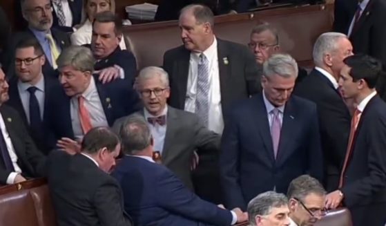 This screen shot depicts Rep. Mike Rogers as he has to be physically restrained from confronting Rep. Matt Gaetz.