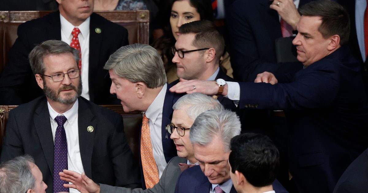 Rep. Mike Rogers of Alabama , center, is restrained by Rep. Richard Hudson of North Carolina after getting into an argument with Florida Rep. Matt Gaetz in the House chamber during the fourth day of elections for speaker of the House on Friday in Washington, D.C.