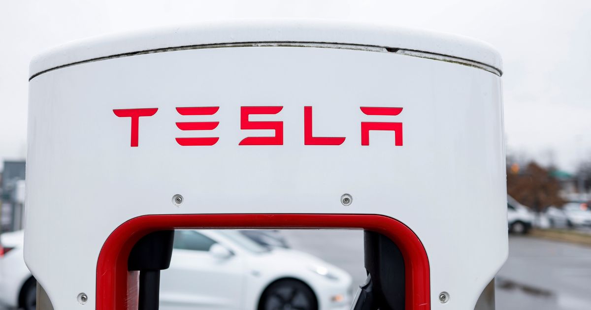 A Tesla charging station stands in a parking lot on Tuesday in Springfield, Virginia.