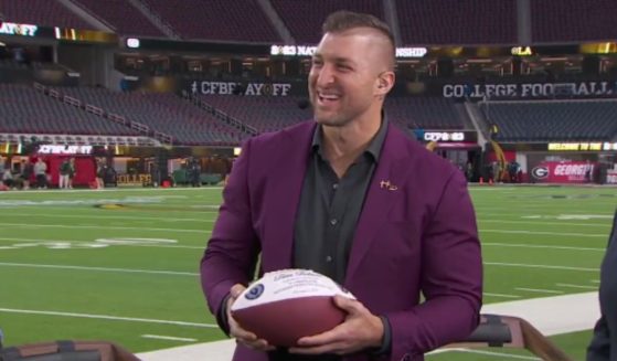 Tim Tebow's fellow on-air ESPN personalities surprised him before Monday's college football national championship game with the announcement that he had been accepted into the College Football Hall of Fame.