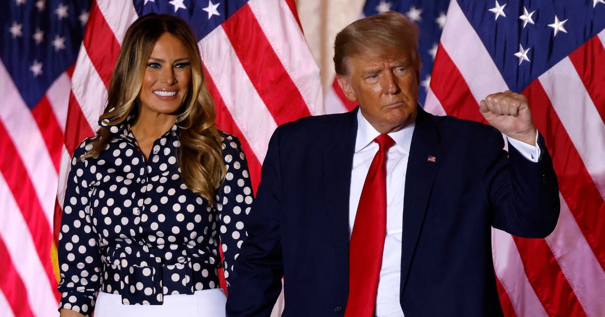 Former President Donald Trump, joined by former first lady Melania Trump, arrives to speak at the Mar-a-Lago Club in Palm Beach, Florida, on Nov. 15.