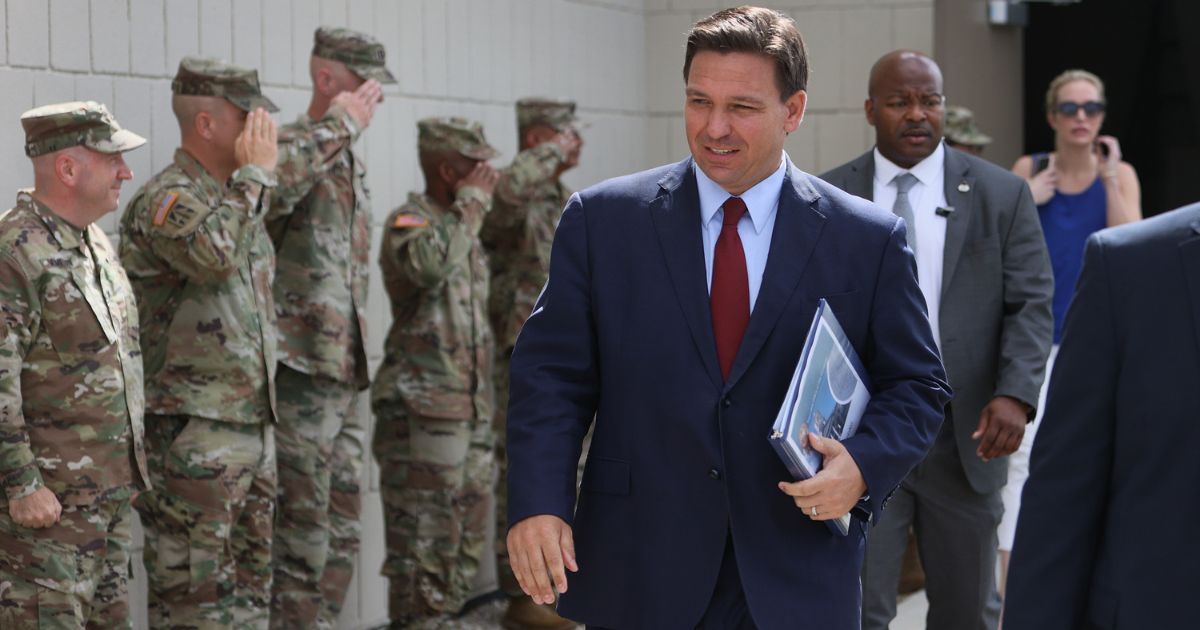 Florida Gov. Ron DeSantis arrives for a bill-signing ceremony at the Florida National Guard armory on June 7, 2021, in Miami. The governor signed the bills to combat foreign influence. Now he's activated the National Guard to deal with immigration problems in the state.