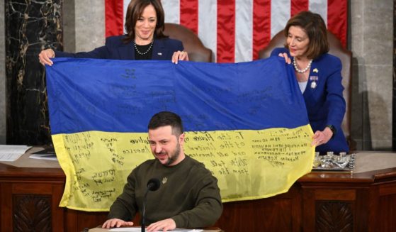 Ukrainian President Volodymyr Zelensky addresses the U.S. Congress as U.S. Vice President Kamala Harris, left, and U.S. House Speaker Nancy Pelosi hold a Ukrainian flag at the U.S. Capitol in Washington, D.C. on Dec. 21, 2022.