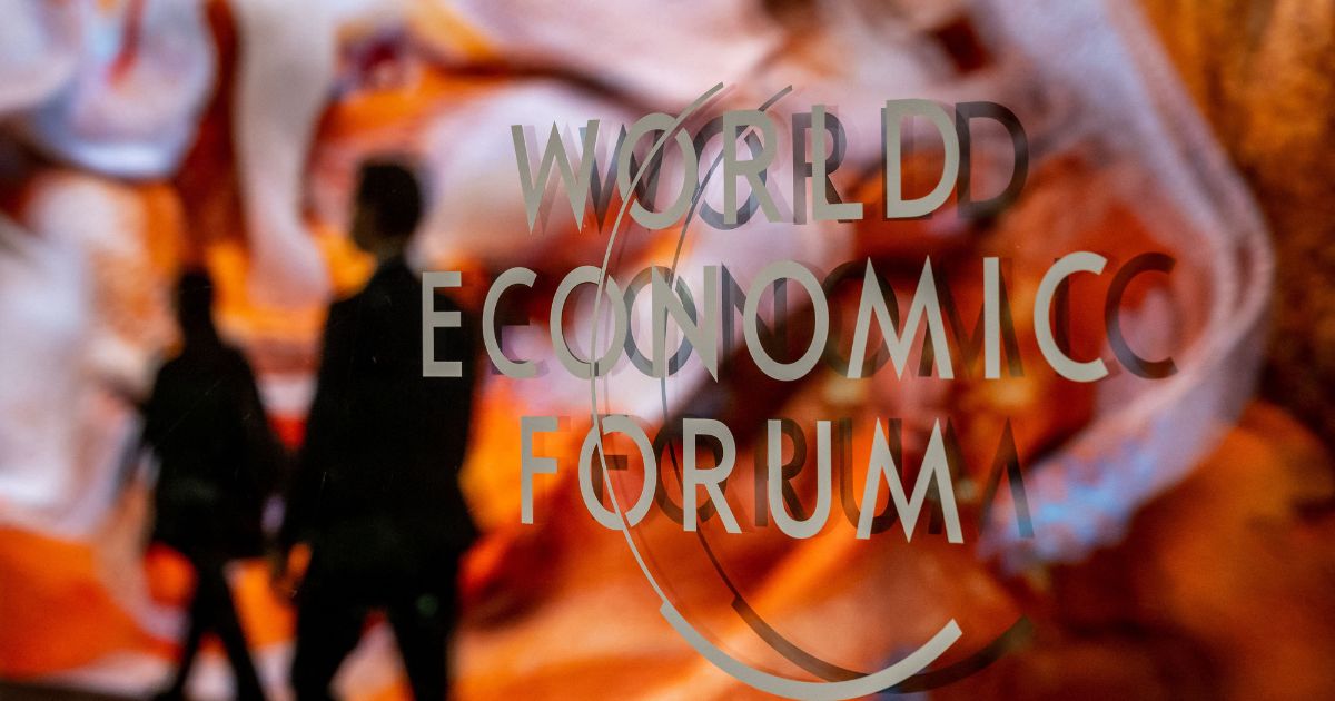 A photograph shows a sign of the World Economic Forum (WEF) in Davos on Monday.