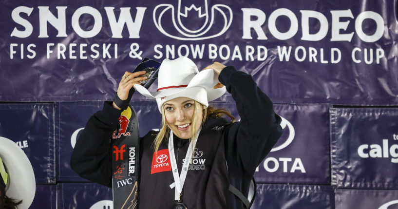 Eileen Gu of China celebrates on the podium after her victory in the women's World Cup freestyle ski halfpipe event in Calgary, Alberta, on Jan. 21.