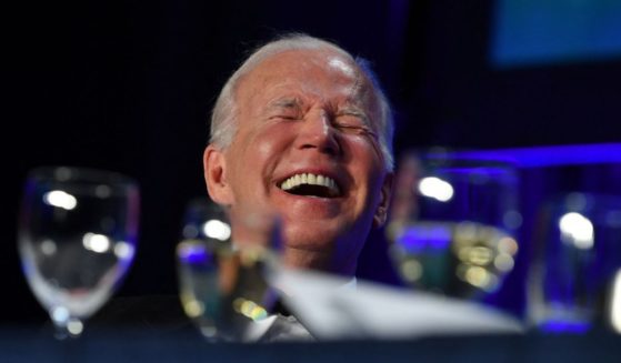 President Joe Biden laughs during the White House Correspondents Association gala at the Washington Hilton Hotel in Washington on April 30.