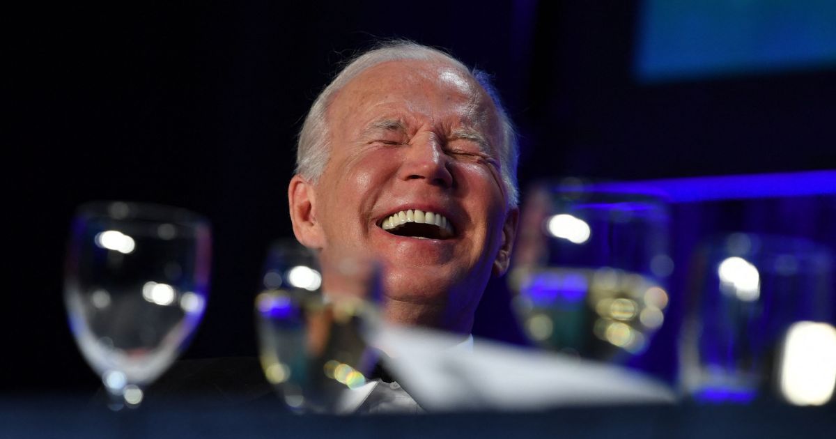 President Joe Biden laughs during the White House Correspondents Association gala at the Washington Hilton Hotel in Washington on April 30.