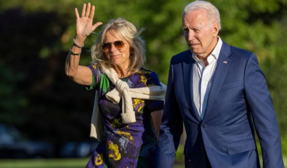 President Joe Biden and First Lady Jill Biden walk on the south lawn of the White House in a file photo from June 2021.