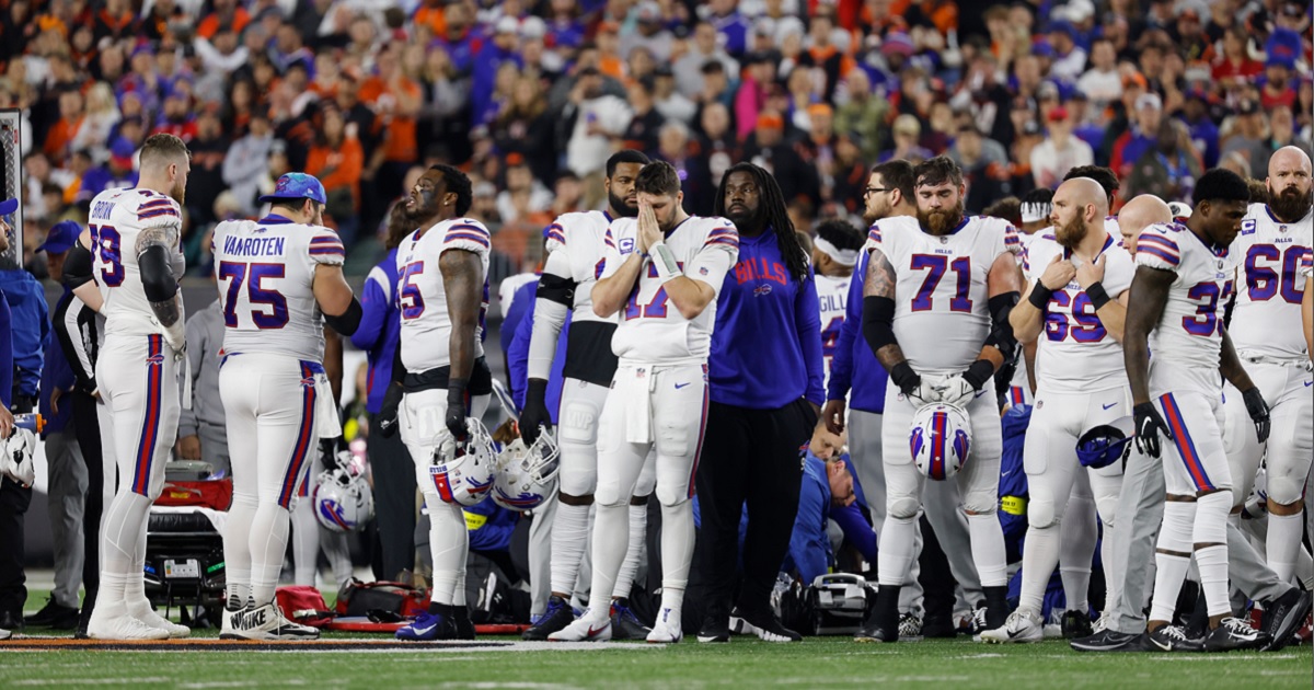 Buffalo Bills players gather and play after safety Damar Hamlin collapsed on the field during Monday night's game against the Cincinnati Bengals at Cincinnati's Paycor Stadium.