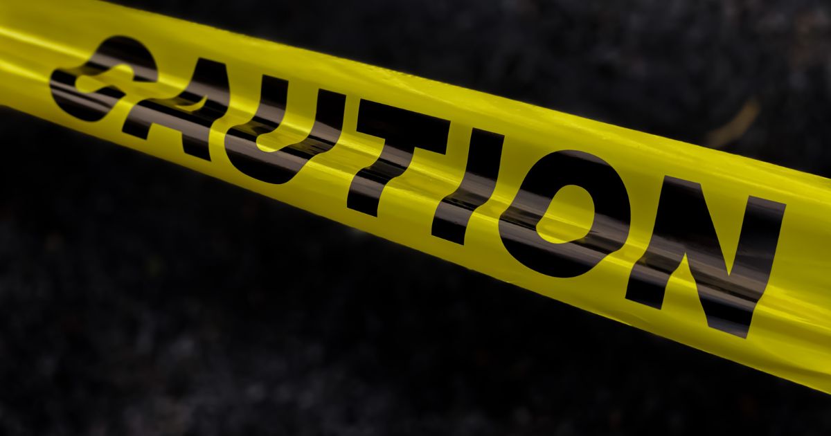 This stock photo shows yellow police caution tape.