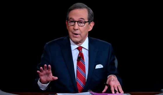 Former Fox News personality Chris Wallace is pictured in a September 2020 file photo from the first presidential debate between then-President Donald Trump and Democrat Joe Biden.