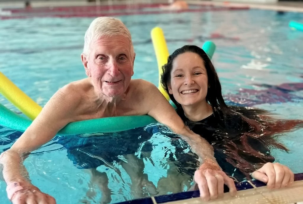 Roget Roberts and care assistant Holli Whitehouse swim together at the Wyre Forest Leisure Centre in Kidderminster, England. This is the first time in 80 year that the World War II veteran has gone swimming.