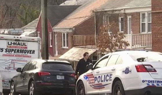 Police investigate a neighborhood believed to be linked to the shooting of a 4-year-old girl Saturday in Washington, D.C.