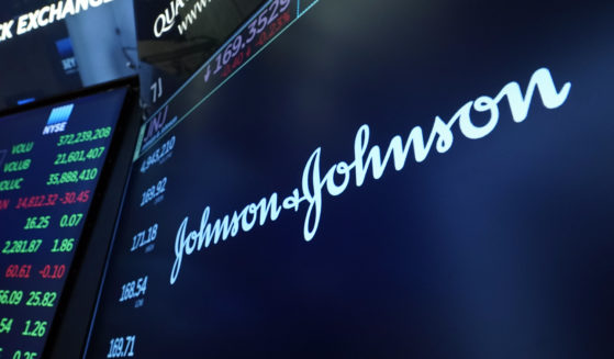 The Johnson & Johnson logo appears above a trading post on the floor of the New York Stock Exchange in New York City on July 21, 2021.